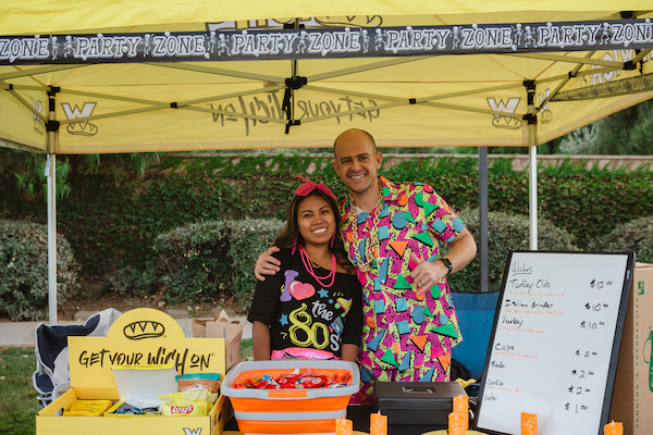 Two vendors standing in their booth
