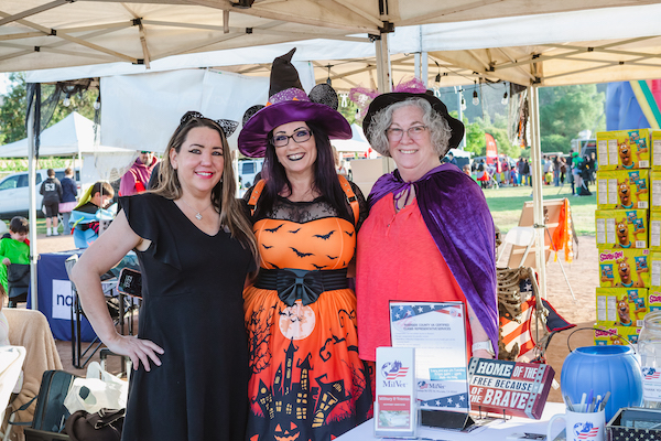 Three women wearing costumes