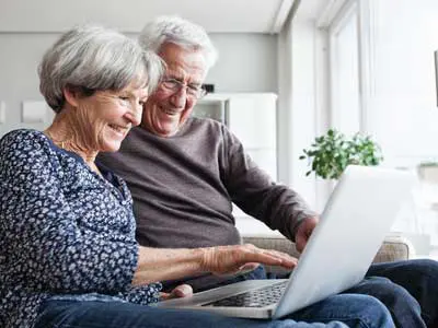 A man and woman taking a risk assessment on a computer