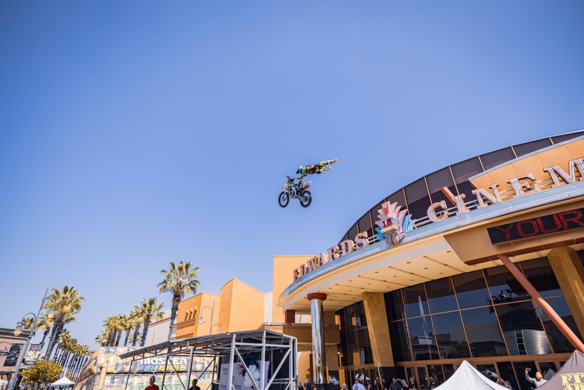 motocross racer jumping over or off a building as a stunt
